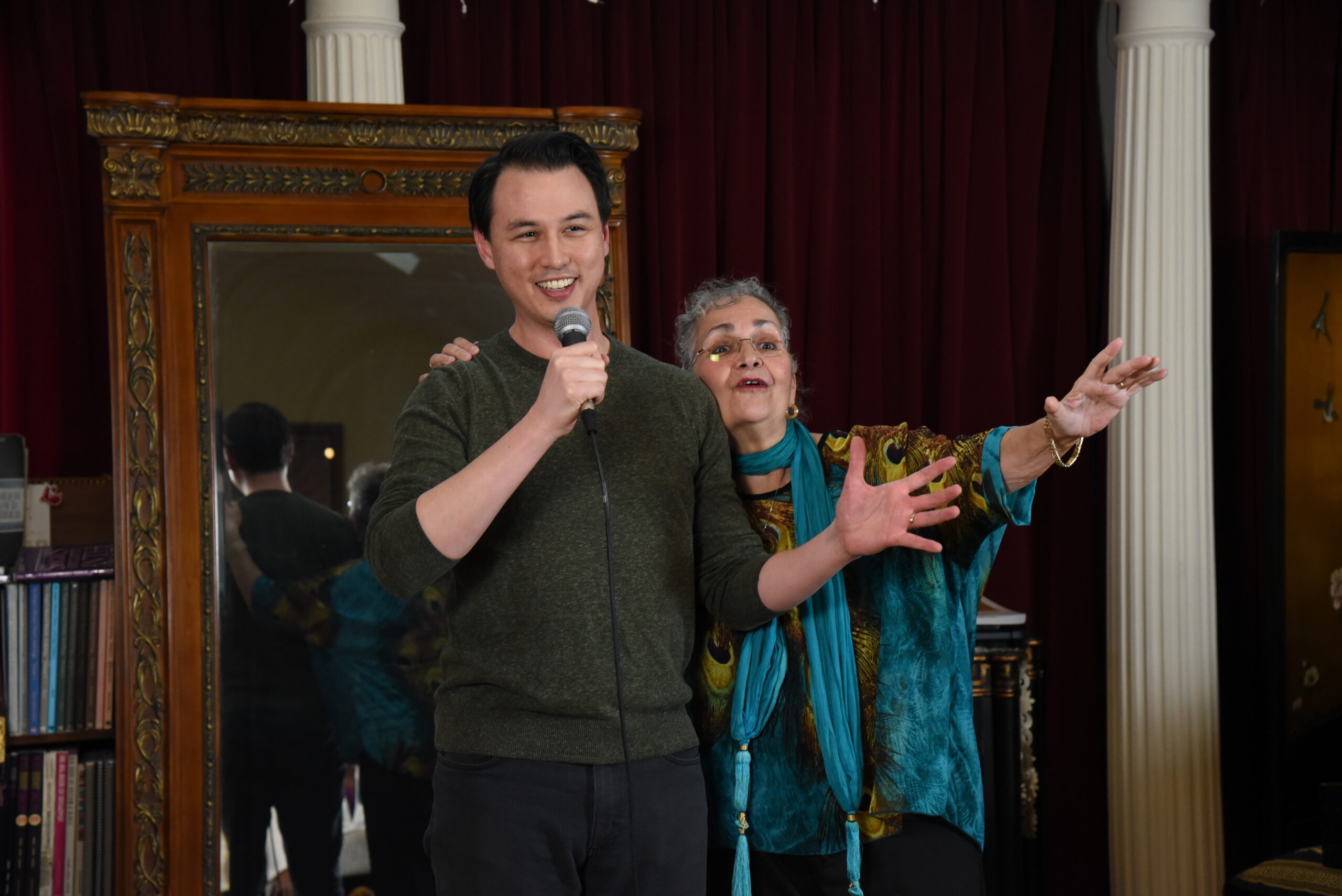 A confident Vocal Mastery student performing with a microphone